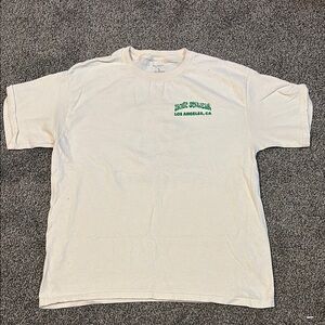 Beige PacSun kids Pacific Sunwear (floral design on the back) Shirt LA, CA